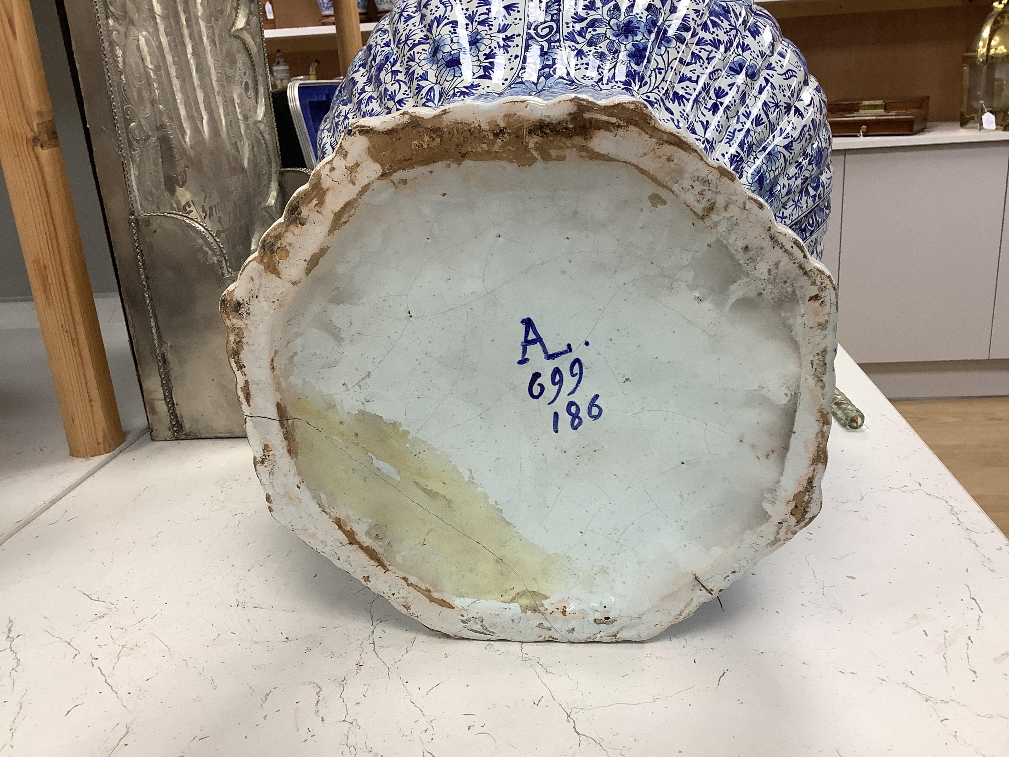 A large Delft blue and white vase and cover, 65cm tall
